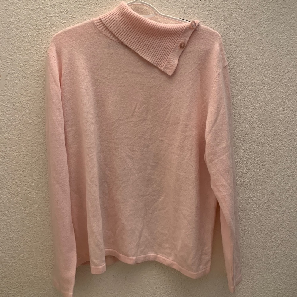 A blush pink turtleneck